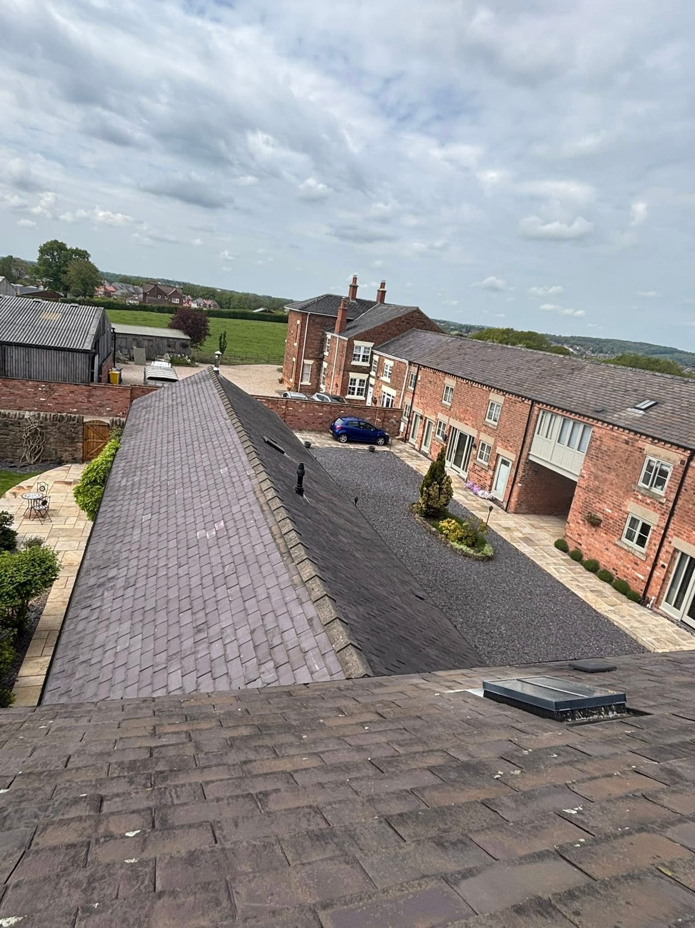 D&G Roofing Derby - aerial view of completed slate reroof on large residential property